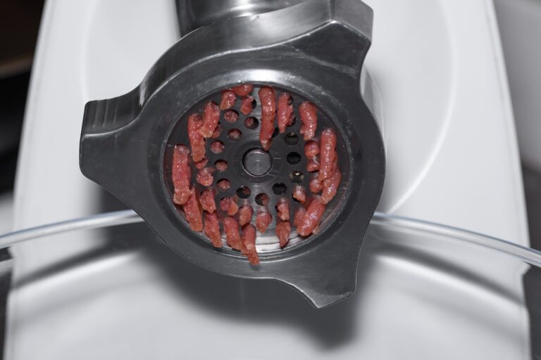 Ground venison in a meat grinder